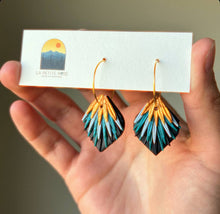 Load image into Gallery viewer, Close view of layered peacock-colored clay hoop earrings on a white display card.
